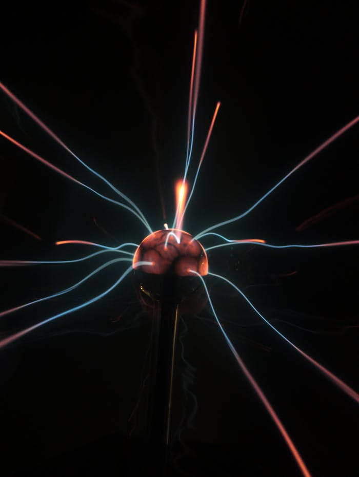 Vibrant plasma ball emitting colorful electrical arcs, creating an electrifying display.